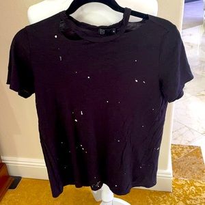 M//C black with white splatters on front of  t-shirt